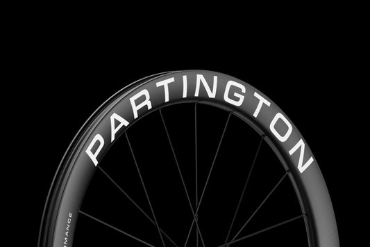 Current-generation Partington R-Series carbon road wheel with bold white rim graphics